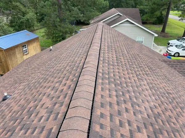 Finished brown architectural shingles with a new ridge vent
