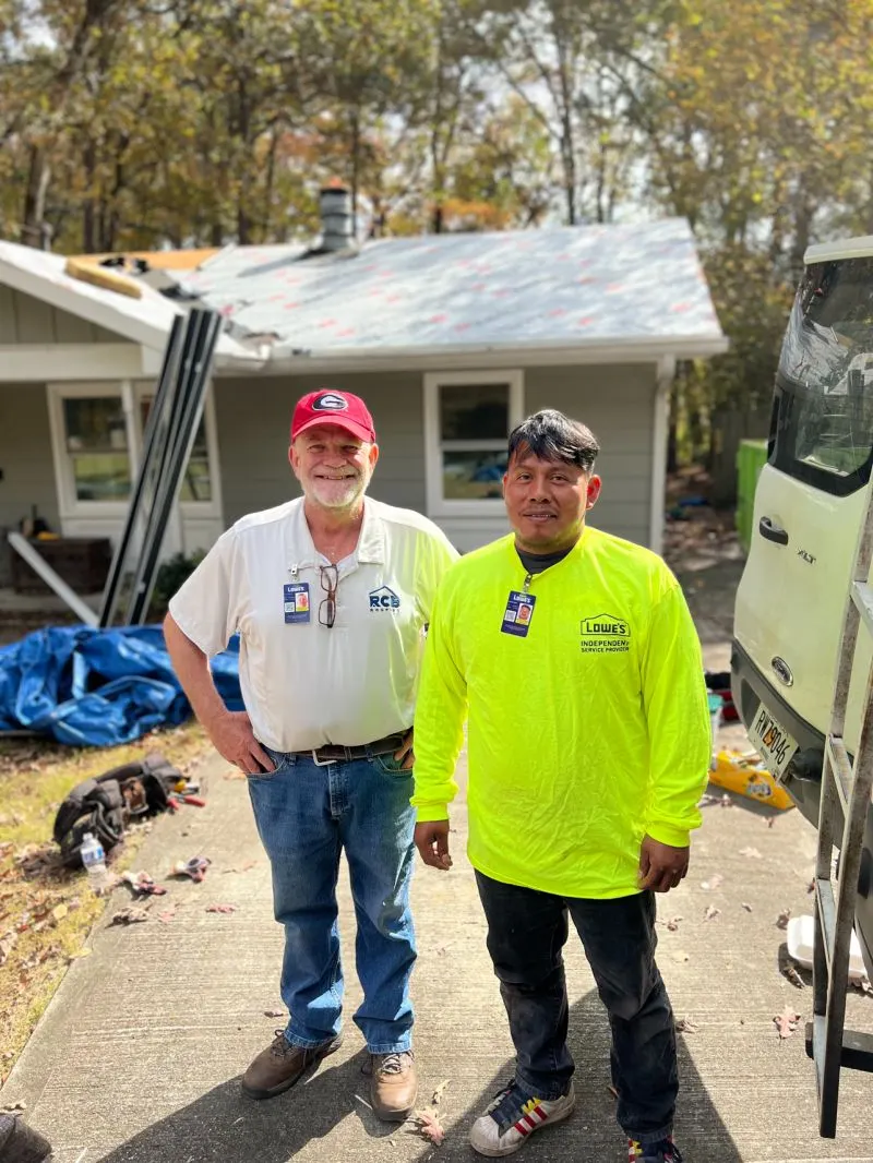 RCB Roofing crew member and Lowe's Independent Service Provider partner on-site at an active roofing job.
